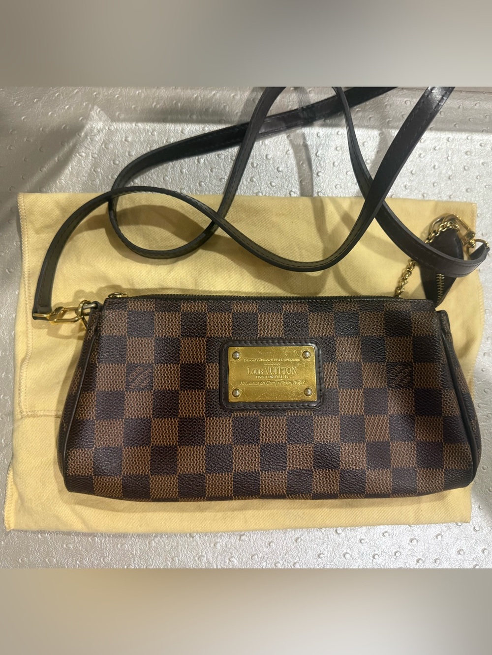 Authentic Louis Vuitton Damier Ebene Eva crossbody bag.